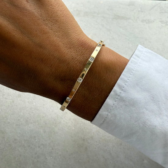 Gold Bangle With 9 Big & Small Diamonds