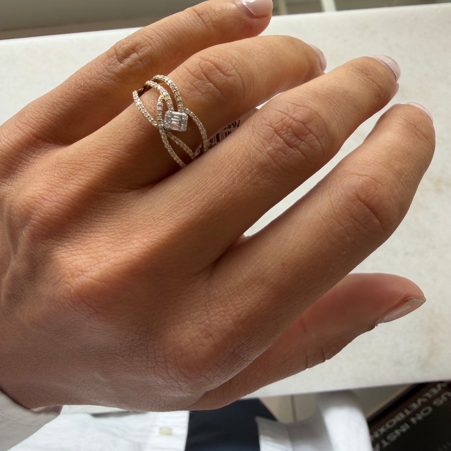 Pave Diamond Interlocking Ring with Center Baguette Emerald