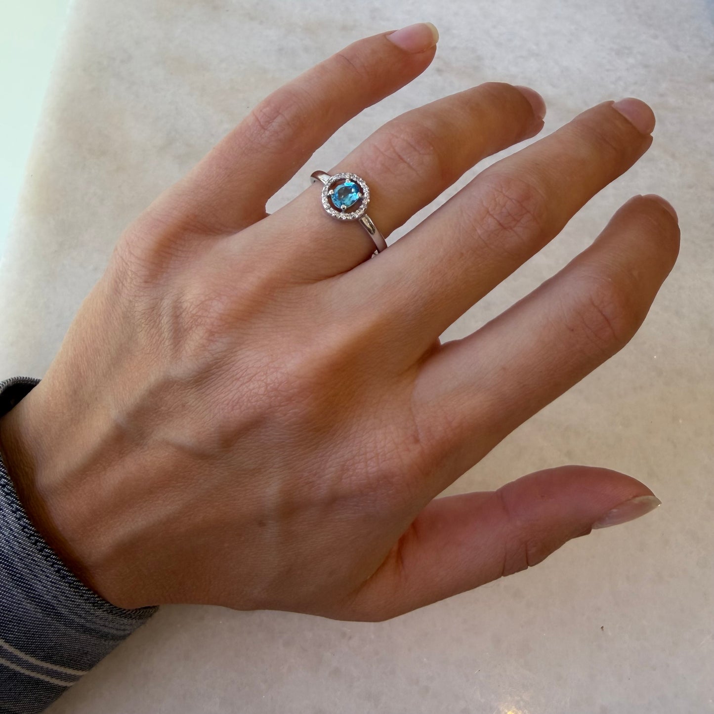 Blue Topaz Oval Halo Diamond Ring