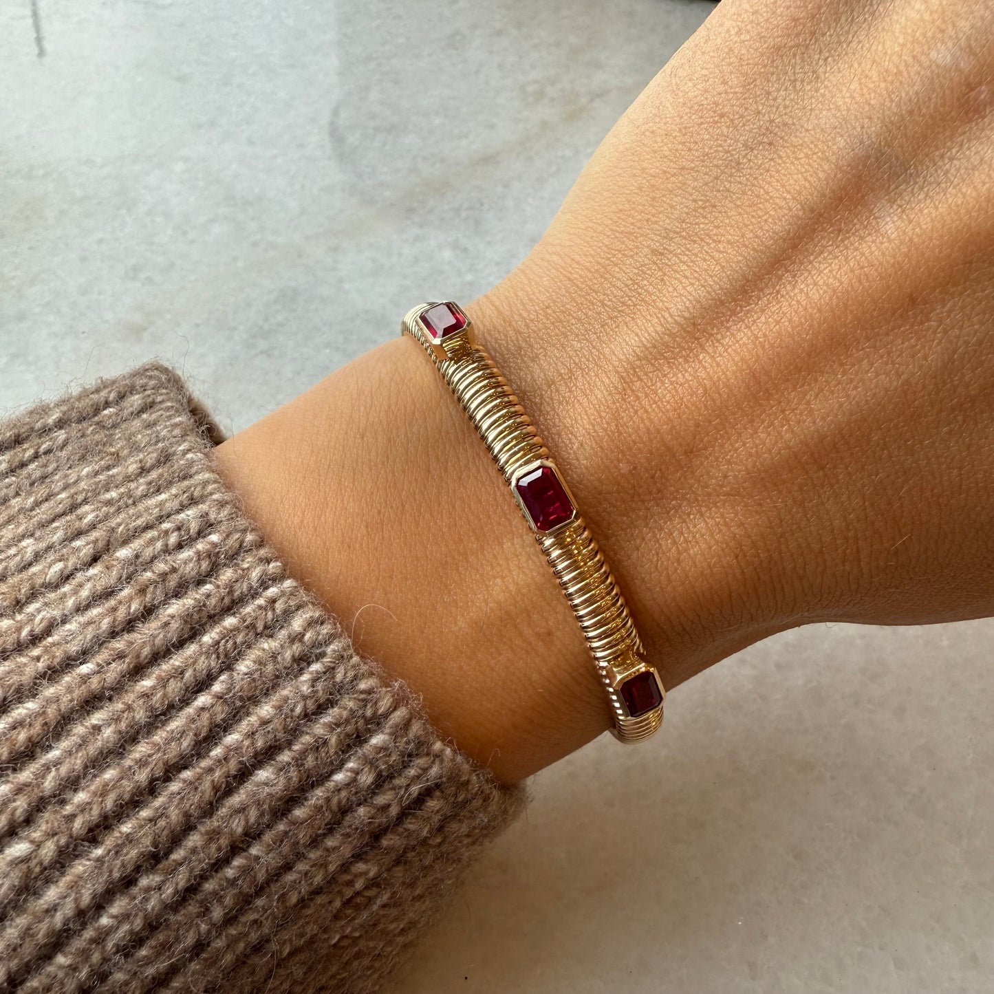 Gold Ribbed Cuff with Three Station Emerald-Cut Rubies