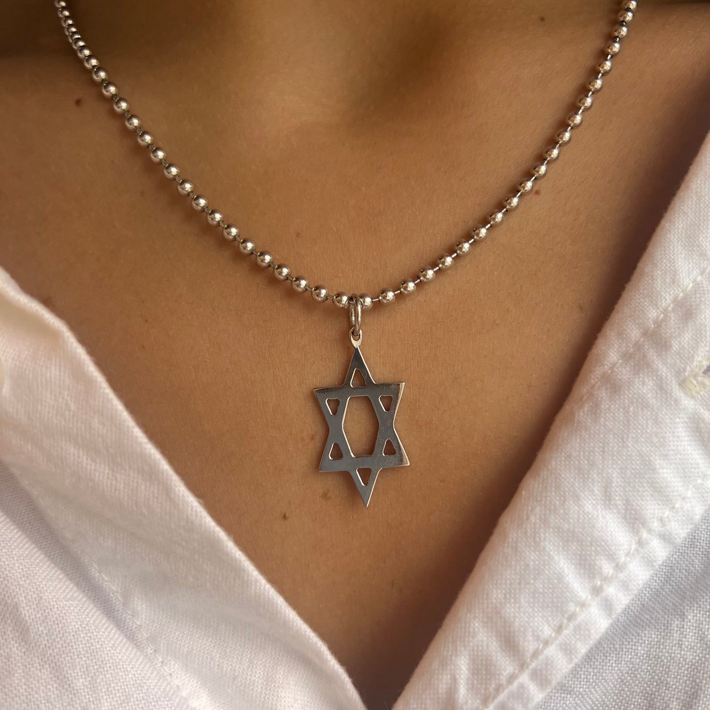 Elongated Gold Magen David Charm