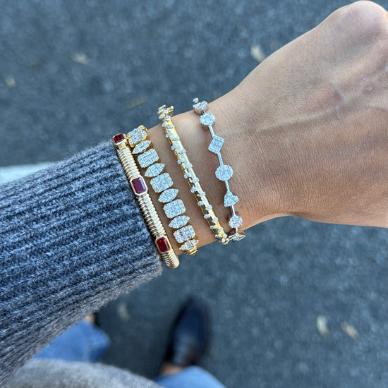 Gold Ribbed Cuff with Three Station Emerald-Cut Rubies