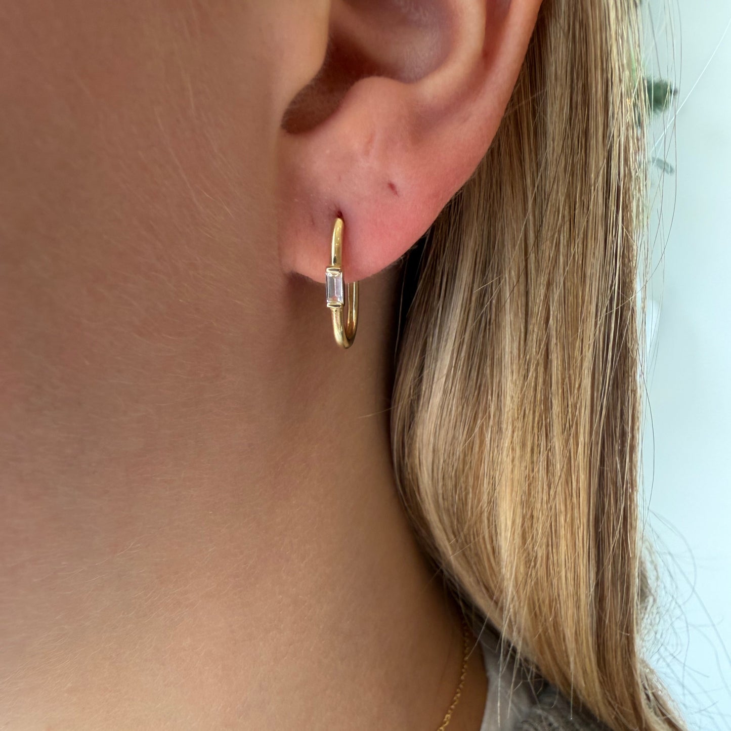 Gold Oval Huggies W/ Baguette White Sapphire